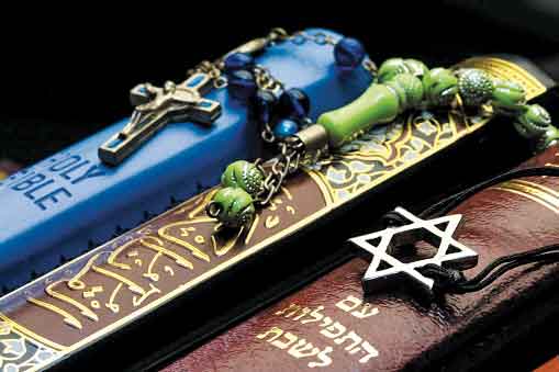 A Christian Bible, Muslim Q’uran and Jewish Bible