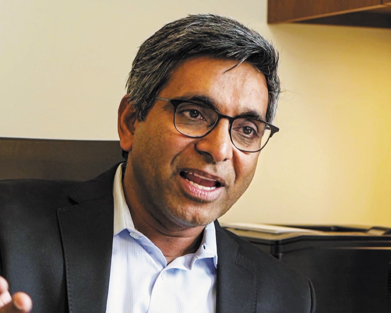 Headshot of Dr. Feroze Mohamed in a suit jacket