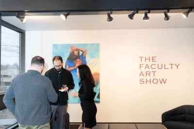 Individuals gathering at the Villanova faculty event