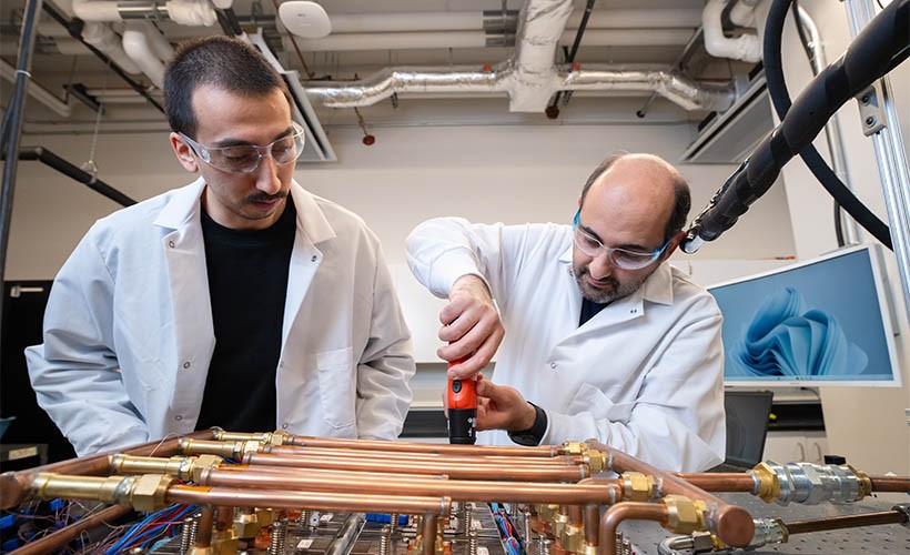 Two grad students working in the ES2 lab
