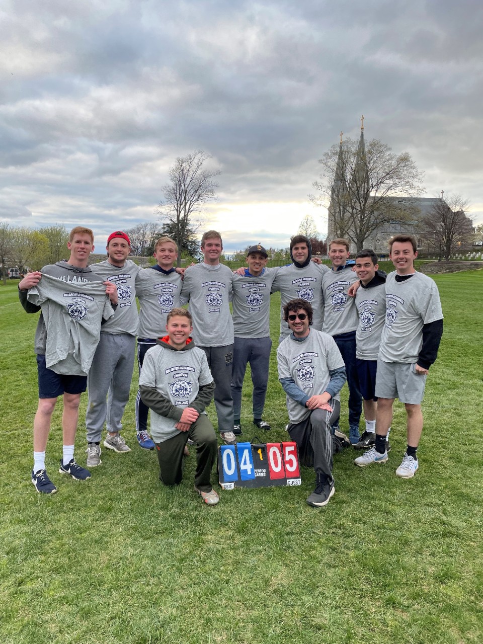 Male students posing for softball champion photo