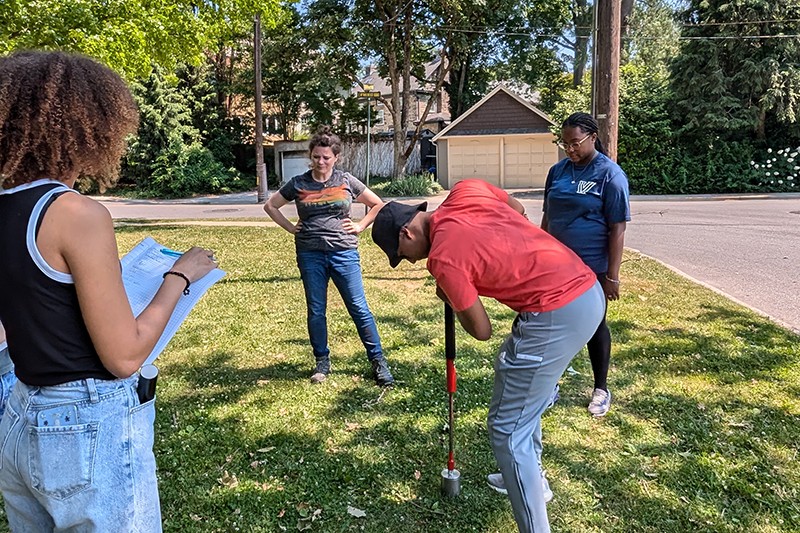students taking core soil samples students taking core soil samples