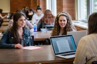 History graduate students working together in the library