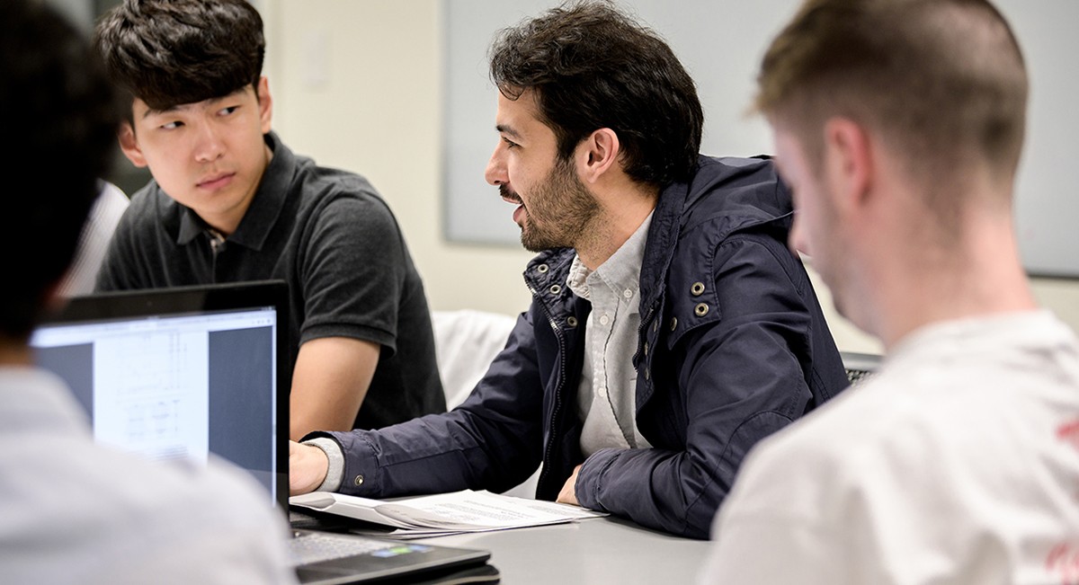 Graduate Computer Science students in class discussion Graduate Computer Science students in class discussion