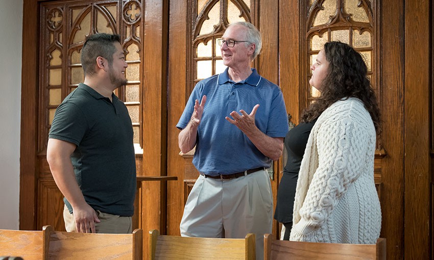 Graduate students and faculty in discussion Graduate students and faculty in discussion