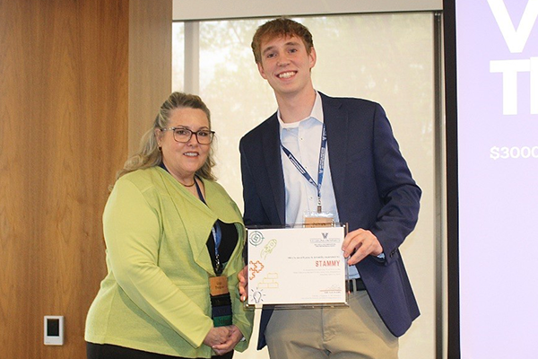 Julian Muncan Accepts Third-Place VSEC Award