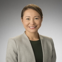 Female coordinator with brown hair smiling