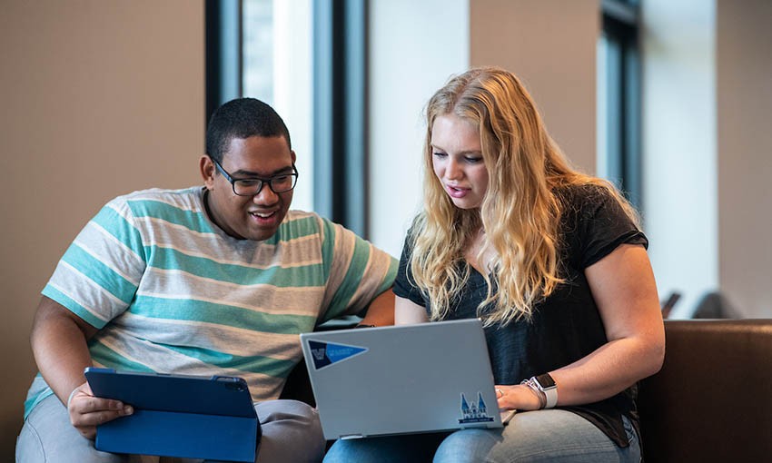 students-looking-at-laptop students-looking-at-laptop