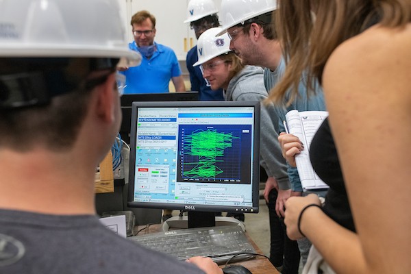 Students viewing data on monitor