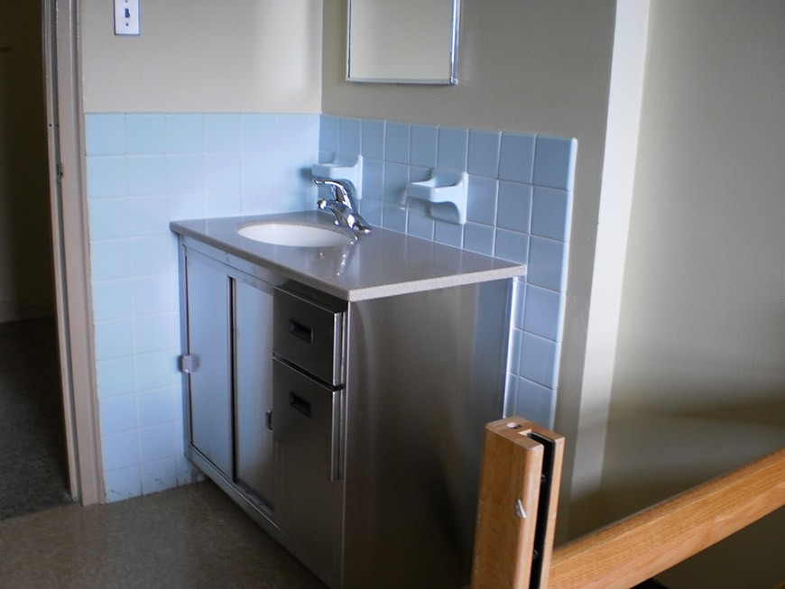 View of the sink and vanity area in a St. Mary's Hall single room.