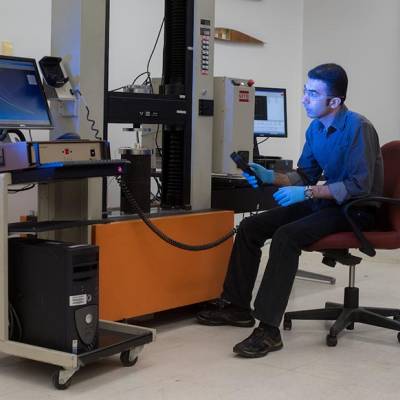 Compression test of a refractory ceramic composite sample in the Laboratory for the Mechanics of Materials and Processing.