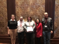 WXV&U Health group holds award certificate