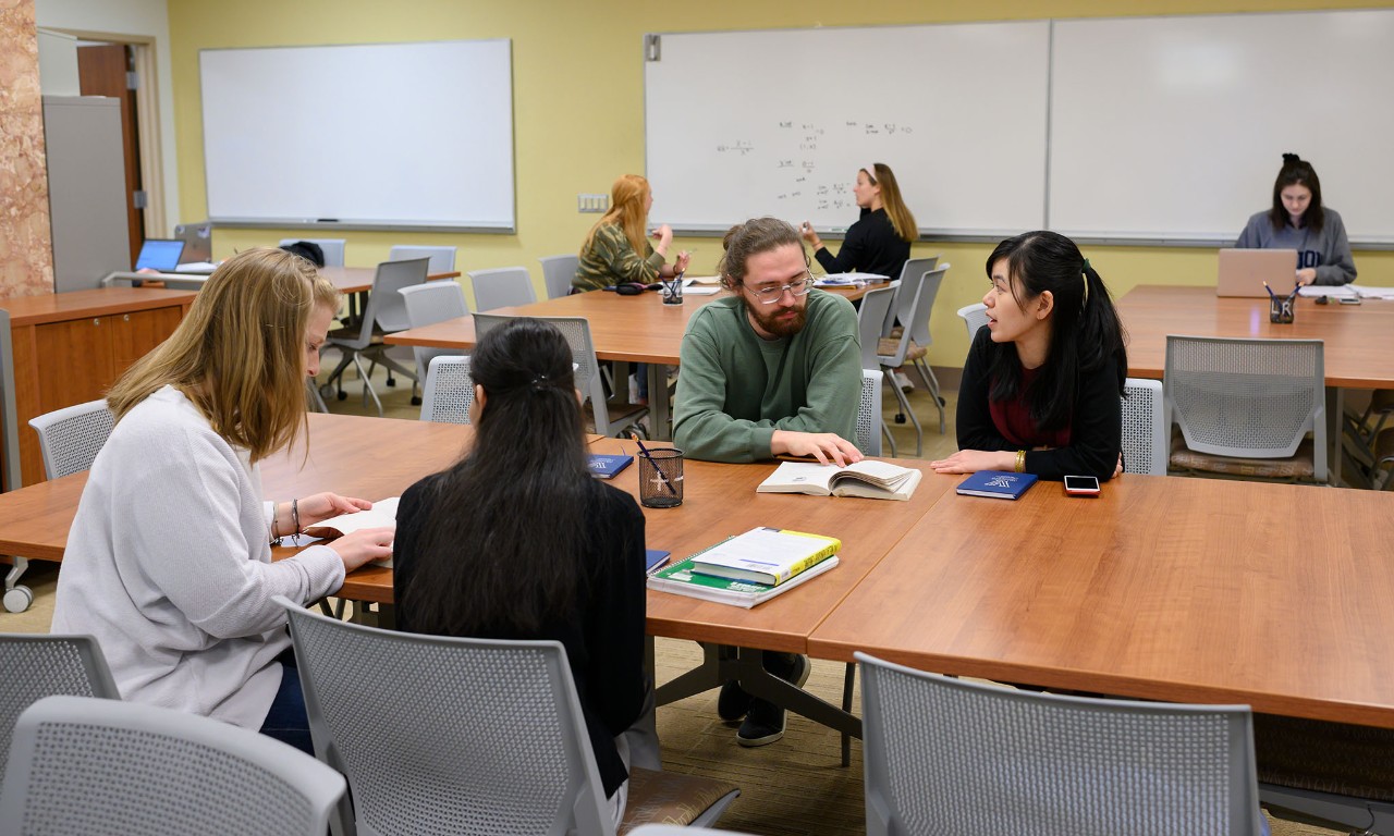 Tutor and student at table
