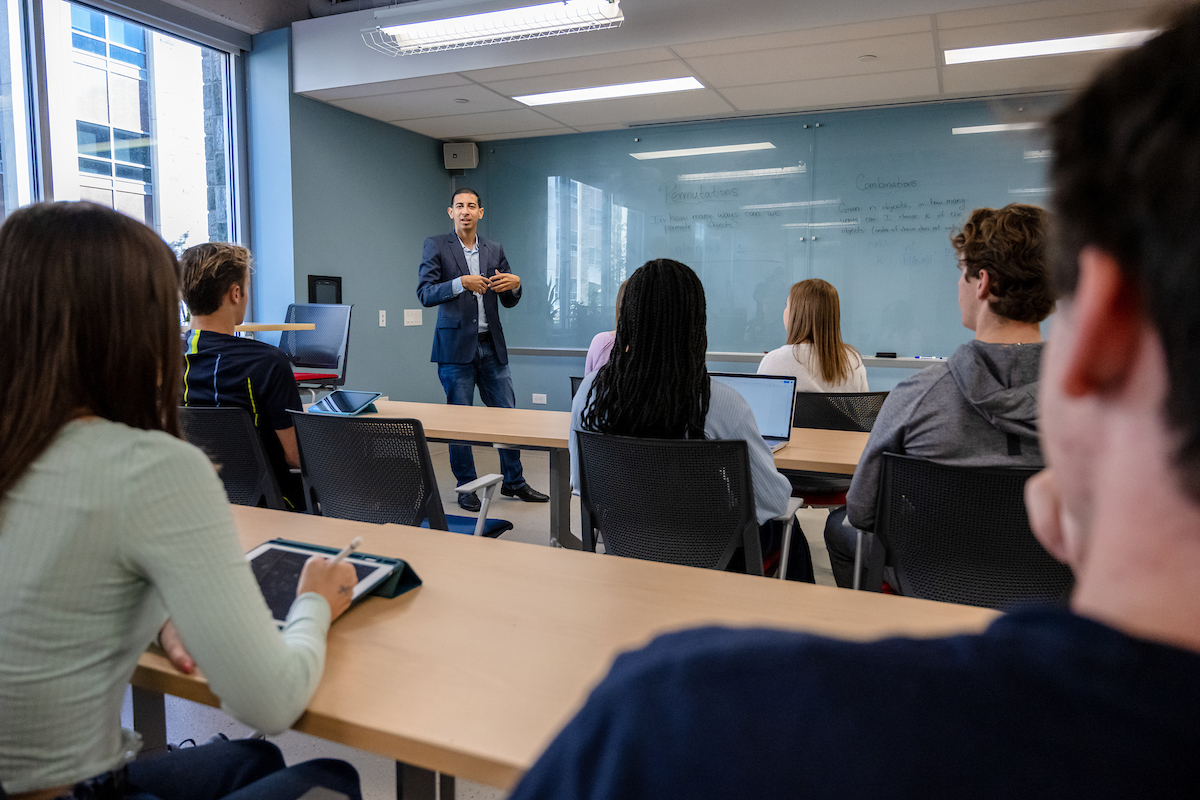 Professor Teaches Students in Math Classroom
