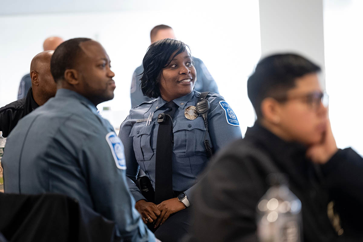 Public safety officers listening to someone speaking off camera