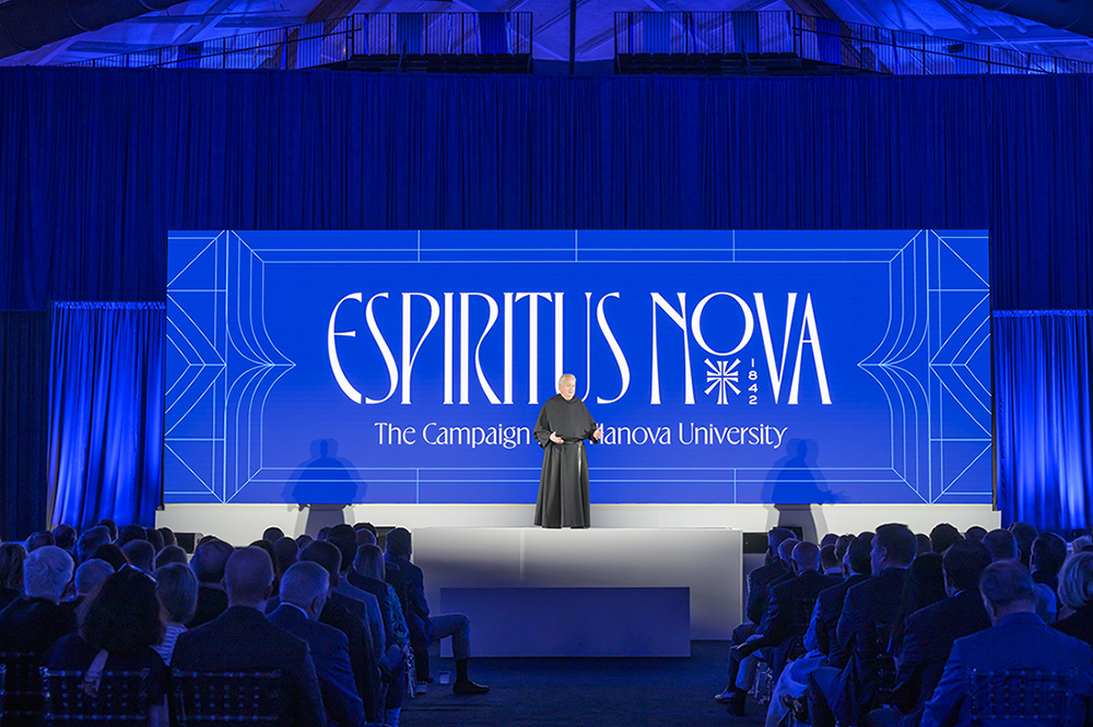 Father Peter with Espiritus Nova backdrop