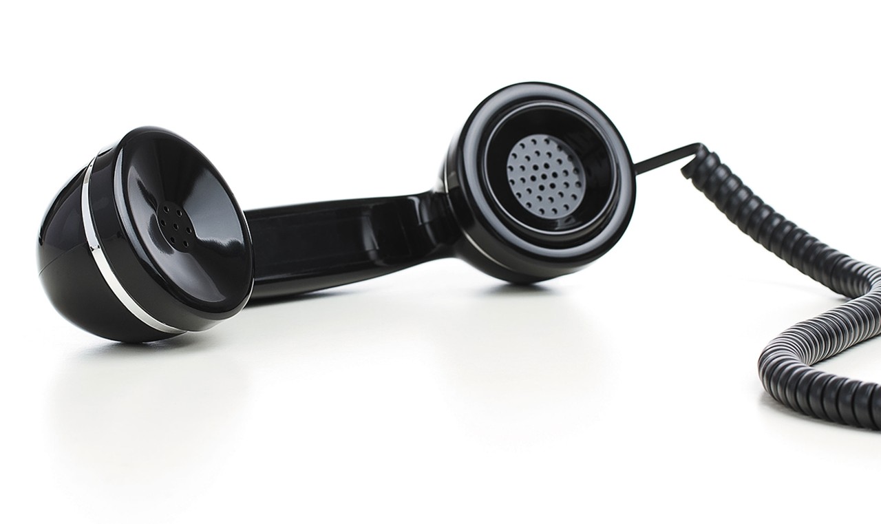 vintage black phone handset with cord