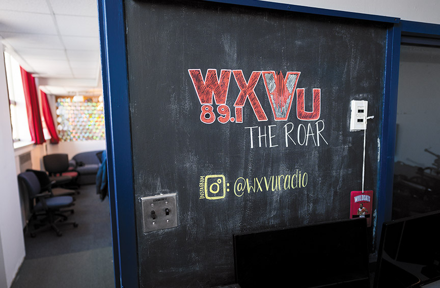 a chalkboard with WXVU 89.1 the Roar written on it