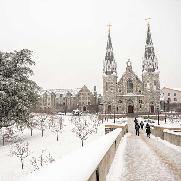 Wide shot of St. Thomas of Villanova Church after a snowfall.